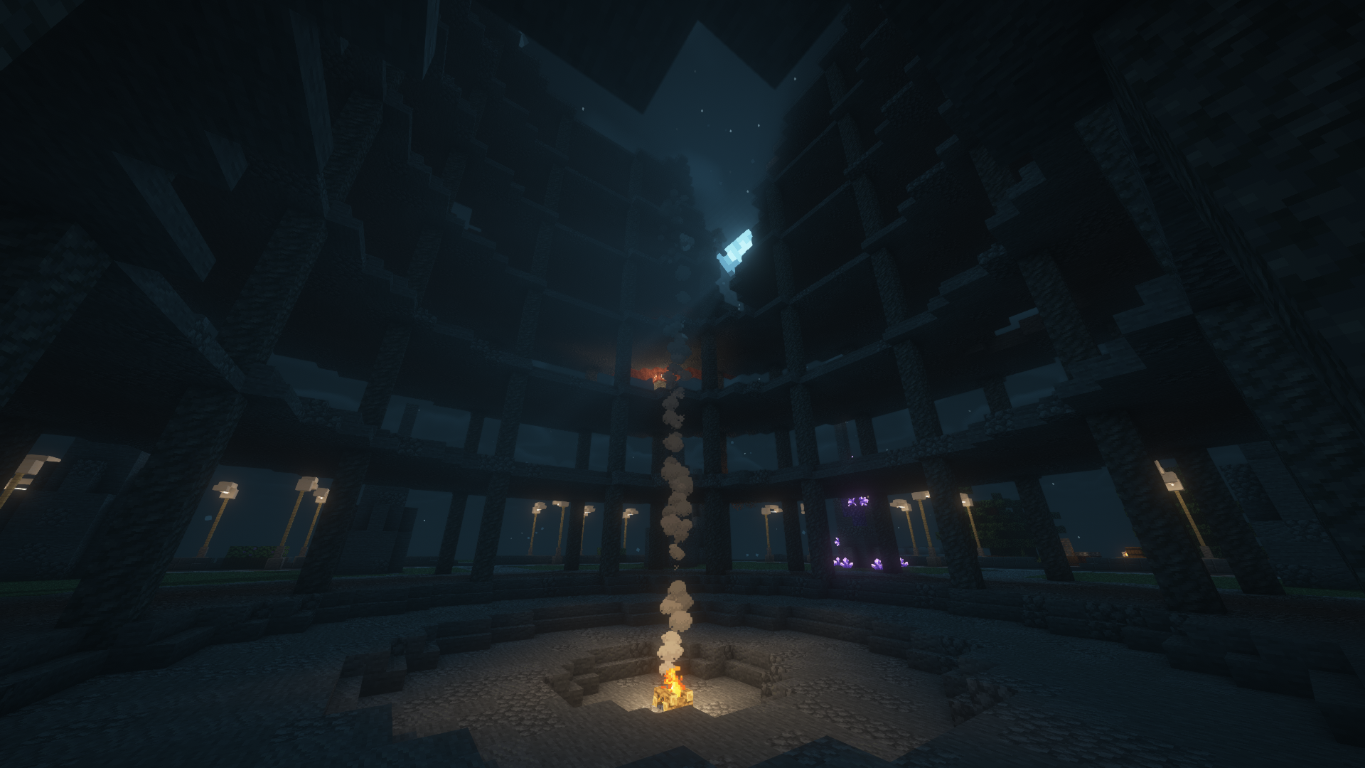 Minecraft build of an arena with a fire in the middle